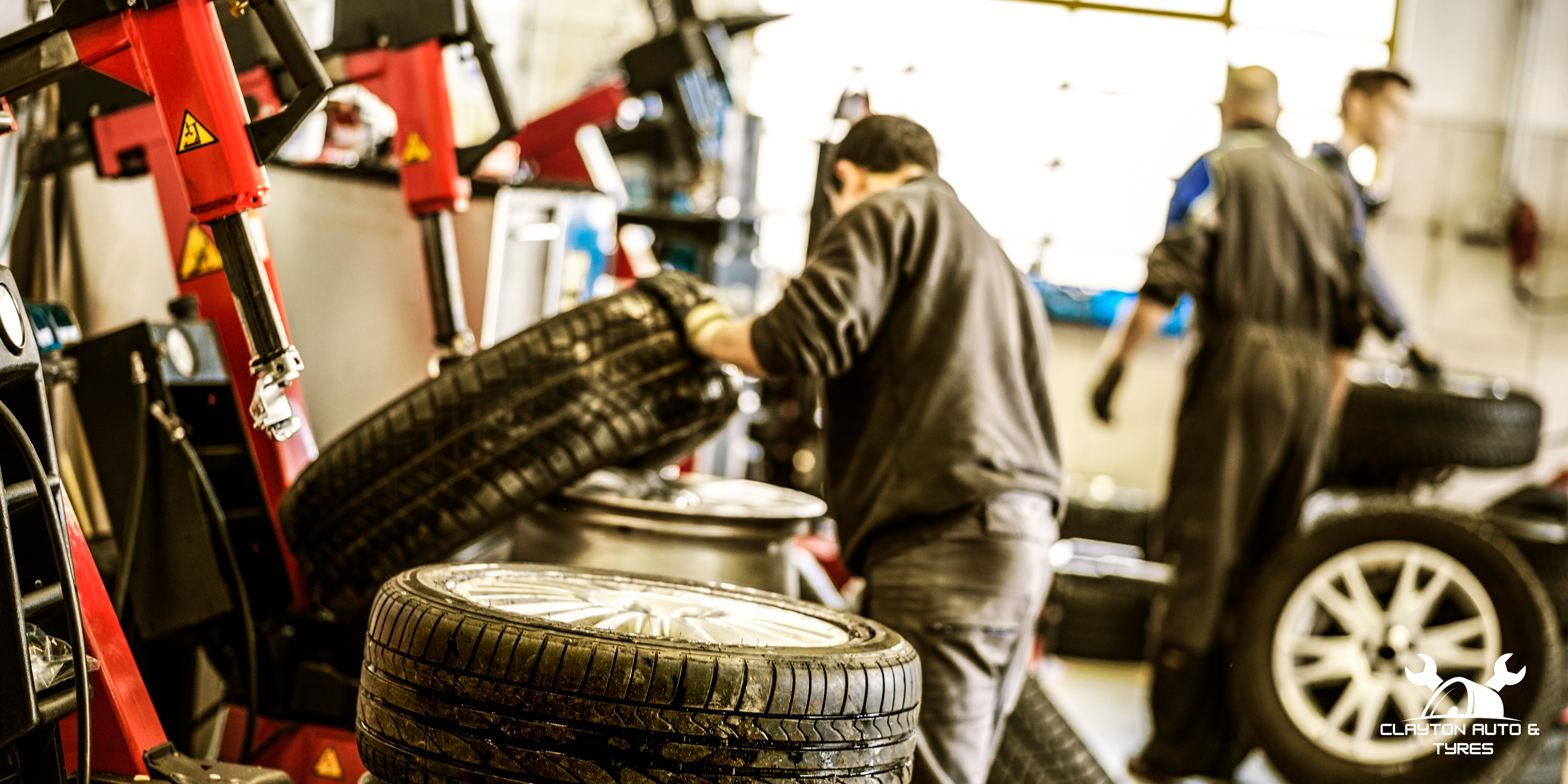 Mechanic Performing Tyre Replacement In Clayton
